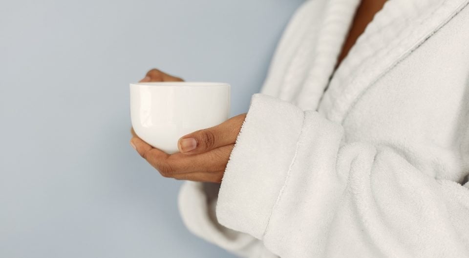 Woman standing while wearing a bemboka bathrobe