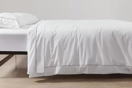 cotton percale duvet cover in white with black piping
