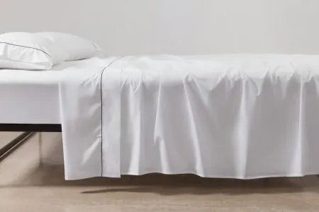 cotton percale sheeting in white with black piping