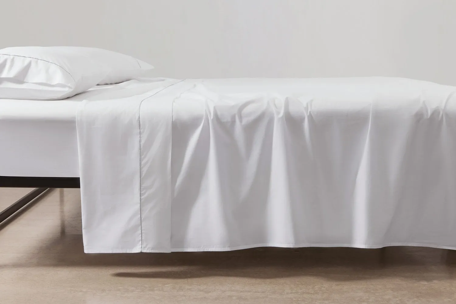 cotton percale sheeting in white with silver piping